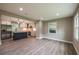 Modern open kitchen featuring an island, stainless appliances, and hardwood floors at 5961 John St, Austell, GA 30106