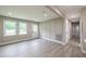 Bright living area featuring hardwood flooring and natural light at 5961 John St, Austell, GA 30106