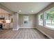 Inviting living area with large windows and stylish hardwood flooring at 5961 John St, Austell, GA 30106