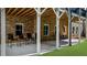 View of a covered patio, providing ample space for outdoor living and entertaining with a connected backyard at 10140 Grandview Sq, Duluth, GA 30097