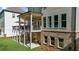 View of a home's exterior, featuring a covered patio and outdoor seating area with natural light at 10140 Grandview Sq, Duluth, GA 30097
