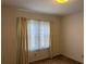 Bedroom with a window offering ample natural light and carpet flooring at 1046 Sans Souci Way, Clarkston, GA 30021