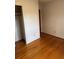 Bright bedroom with polished hardwood floors and a spacious closet at 1046 Sans Souci Way, Clarkston, GA 30021