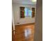 Comfortable bedroom with hardwood flooring, a bright window, and neutral walls at 1046 Sans Souci Way, Clarkston, GA 30021