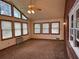 Sun-filled living room with large windows and carpet floors at 1046 Sans Souci Way, Clarkston, GA 30021