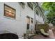 Back of building with patio area including grill and seating with easy access to the unit at 1683 Briarcliff Ne Rd # 4, Atlanta, GA 30306