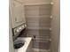 Practical laundry room featuring a washer, dryer, and wire shelving for storage at 1683 Briarcliff Ne Rd # 4, Atlanta, GA 30306