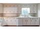 Functional kitchen with white cabinets, ample counter space, and a modern dishwasher at 2047 Cliffton Ter, Snellville, GA 30039