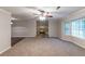 Large living room with a stone fireplace and a large window, perfect for gatherings at 2047 Cliffton Ter, Snellville, GA 30039