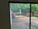 View of outdoor deck featuring a seating area and tranquil greenery visible through sliding glass doors at 267 Toweridge Sw Dr, Marietta, GA 30064