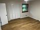 Bright bedroom features wood-look floors, large closet and window at 267 Toweridge Sw Dr, Marietta, GA 30064