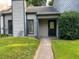 Charming home featuring a quaint front entry with a dark front door and well-maintained lawn at 267 Toweridge Sw Dr, Marietta, GA 30064
