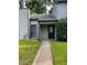 Charming home featuring a quaint front entry with a dark front door and well-maintained lawn at 267 Toweridge Sw Dr, Marietta, GA 30064