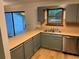 Well-lit kitchen featuring green cabinets, countertops, and stainless steel appliances at 267 Toweridge Sw Dr, Marietta, GA 30064