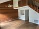 Spacious living room with hardwood floors, wooden accent wall, and natural lighting at 267 Toweridge Sw Dr, Marietta, GA 30064