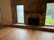 Inviting living room boasts a stone fireplace and windows offering views of the lush outdoors at 267 Toweridge Sw Dr, Marietta, GA 30064