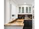 Custom bar area with granite countertops, sink, and storage at 3415 Habersham Nw Rd, Atlanta, GA 30305