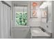 Bright bathroom with a large window and a marble countertop brings charm and functionality at 3415 Habersham Nw Rd, Atlanta, GA 30305