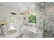 Luxurious bathroom features double sinks and a marble shower with glass enclosure at 3415 Habersham Nw Rd, Atlanta, GA 30305
