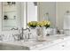 Elegant bathroom vanity featuring marble countertops, double sinks, and decorative accents at 3415 Habersham Nw Rd, Atlanta, GA 30305