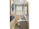 Stylish half bathroom with updated fixtures, granite countertop, and decorative mirror at 3415 Habersham Nw Rd, Atlanta, GA 30305