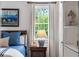Cozy bedroom with wood floors and a bright window is the perfect retreat at 3415 Habersham Nw Rd, Atlanta, GA 30305