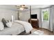 Comfortable bedroom with a four-poster bed and lots of natural light from the window at 3415 Habersham Nw Rd, Atlanta, GA 30305