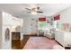Unique bedroom with custom built-in bookshelves and an armchair offers cozy space at 3415 Habersham Nw Rd, Atlanta, GA 30305