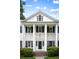 A charming white house with large columns and manicured lawn at 3415 Habersham Nw Rd, Atlanta, GA 30305