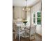 Charming kitchen dining area with a stylish chandelier and lots of natural light at 3415 Habersham Nw Rd, Atlanta, GA 30305