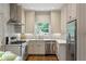 Modern kitchen features stainless steel appliances, white cabinets, and marble countertops at 3415 Habersham Nw Rd, Atlanta, GA 30305