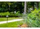 Close up view of beautiful landscaping with a path leading to the home at 3415 Habersham Nw Rd, Atlanta, GA 30305