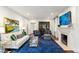 Cozy living room featuring a fireplace and lots of natural light at 3415 Habersham Nw Rd, Atlanta, GA 30305