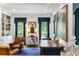 Comfortable living room with blue accents, bookshelves, and natural light at 3415 Habersham Nw Rd, Atlanta, GA 30305