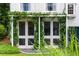 Charming sunroom with views to the garden and climbing vines on the pergola at 3415 Habersham Nw Rd, Atlanta, GA 30305