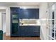 Charming wet bar with wine cooler and marble countertop provides convenience for entertaining at 3415 Habersham Nw Rd, Atlanta, GA 30305
