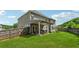 Spacious backyard with lush green grass, patio, and full fence at 3711 Wartrace Dr, Atlanta, GA 30331