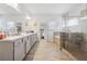 Bright bathroom with double vanity, soaking tub, and glass enclosed shower at 3711 Wartrace Dr, Atlanta, GA 30331