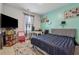 Bright bedroom with modern design elements, comfortable bed, and study area at 3711 Wartrace Dr, Atlanta, GA 30331