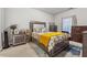 Neutral bedroom with decoratively appointed bed, side table and dresser at 3711 Wartrace Dr, Atlanta, GA 30331