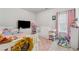 Bright, stylish bedroom with a white cot and single bed, and large-screen TV at 3711 Wartrace Dr, Atlanta, GA 30331