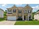 Charming two-story brick home featuring a well-manicured lawn and attached two car garage at 3711 Wartrace Dr, Atlanta, GA 30331