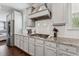 Modern kitchen features white cabinets, granite countertops, stainless steel appliances, and hardwood floors at 3711 Wartrace Dr, Atlanta, GA 30331