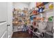 Walk-in pantry with floor to ceiling metal racks full of various food and drink items at 3711 Wartrace Dr, Atlanta, GA 30331