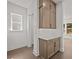 A stylish butler pantry with upper and lower cabinets and quartz countertops at 4445 Beechnut Circle, Cumming, GA 30028
