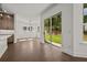 Dining area featuring hardwood floors, a modern light fixture, and sliding glass doors to the yard at 4445 Beechnut Circle, Cumming, GA 30028
