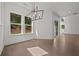 An airy dining room featuring lots of light and hardwood floors at 4445 Beechnut Circle, Cumming, GA 30028