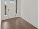 Inviting entryway with hardwood floors and natural light streaming through the front door at 4445 Beechnut Circle, Cumming, GA 30028