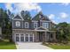 Charming two-story home featuring a stylish facade and inviting curb appeal at 4445 Beechnut Circle, Cumming, GA 30028
