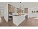 Spacious eat-in kitchen with stainless steel appliances and a large center island at 4445 Beechnut Circle, Cumming, GA 30028